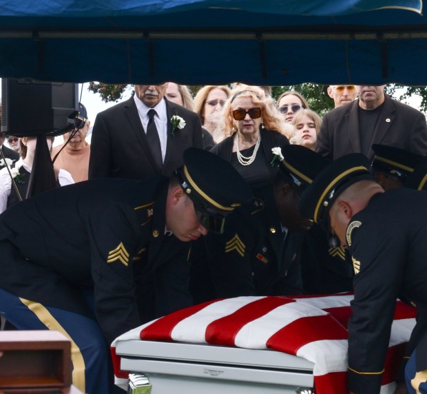 Joan Vannatta stands by as veterans drape the casket of her uncle, U.S. Army Private First Class Howard G. Krapf, on Monday, Sept. 21, 2026, at Fairview Cemetery in Whitehall. Krapf was killed in action during World War II but his remains were unidentified for 82 years. (Monica Cabrera/The Morning Call)