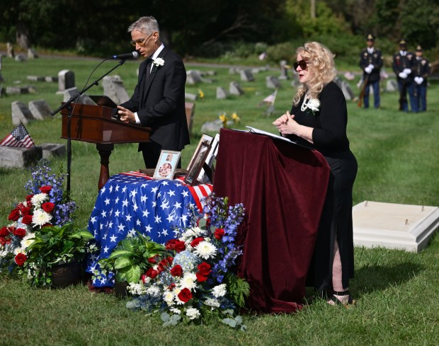 Aaron Vannatta reads the eulogy as Joan Vannatta translates into sign languageat during the funeral of family member, U.S. Army Private First Class Howard G. Krapf, on Monday, Sept. 21, 2026, at Fairview Cemetery in Whitehall. Krapf was killed in action during World War II but his remains were unidentified for 82 years. (Monica Cabrera/The Morning Call)