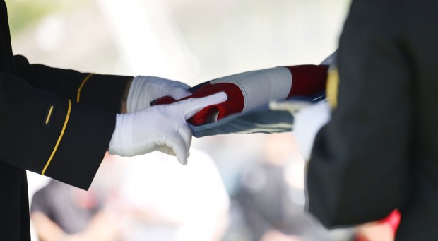 Veterans participate in a flag-folding and presentation ceremony at the funeral of US Army Private First Class Howard G. Krapf on Monday, Sept. 21, 2026, at Fairview Cemetery in Whitehall. Krapf was killed in action during World War II but his remains were unidentified for 82 years. (Monica Cabrera/The Morning Call)
