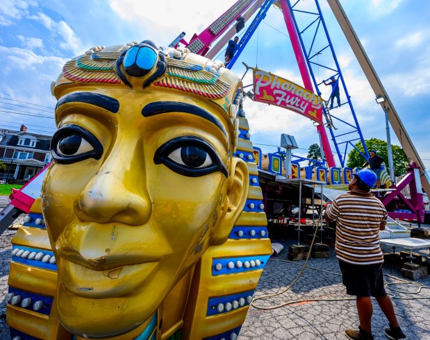 Workers assemble the Pharaoh's Fury ride Tuesday, Sept. 1, 2026, at the Allentown Fairgrounds. The 174th Allentown Fair opens Wednesday and runs through Labor Day. (April Gamiz/The Morning Call)