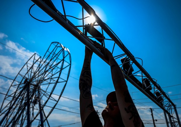 Performer Steve Goodtime, who describes his performance as rock n roll circus show, assembles part of his stage lights Tuesday, Sept. 1, 2026, at the Allentown Fairgrounds. Goodtime is one of dozens of performers at the 174th Allentown Fair, which opens Wednesday and runs through Labor Day. (April Gamiz/The Morning Call)