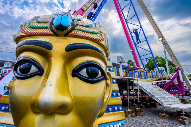 Workers assemble the Pharaoh's Fury ride Tuesday, Sept. 1, 2026, at the Allentown Fairgrounds. The 174th Allentown Fair opens Wednesday and runs through Labor Day. (April Gamiz/The Morning Call)