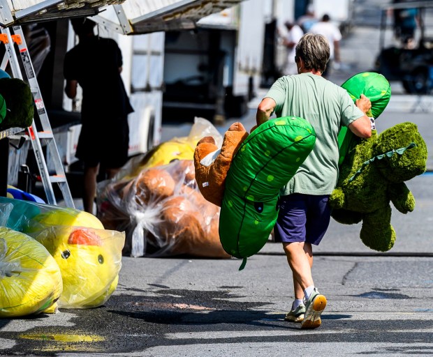 Workers prepare rides, games, and food areas the day before opening day of the Allentown Fair on Tuesday, Sept. 1, 2026, at the Allentown Fairgrounds. The 174th fair opens Wednesday and runs through Labor Day. (April Gamiz/The Morning Call)