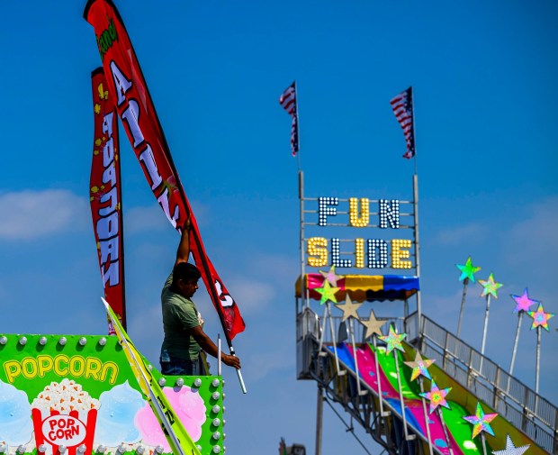 Workers prepare rides, games, and food areas the day before opening day of the Allentown Fair on Tuesday, Sept. 1, 2026, at the Allentown Fairgrounds. The 174th fair opens Wednesday and runs through Labor Day. (April Gamiz/The Morning Call)