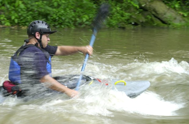 Up the creek and loving it Kurt Jensen from Perkasie 'surfs' a rapid with his kayak in the Little Lehigh Creek in Little Lehigh Park, Allentown on Thursday evening, June 29, 2000, following a sudden downpour which raised the water level several inches. Jensen was on the creek with the Lehigh Valley Canoe club, which practices in the Little Lehigh Creek on Tuesday and Thursday nights. (ED LANDROCK/TMC)