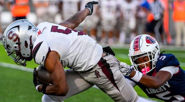 Stroudsburg's Keyen Johnson carries the ball down the field Thursday, Sept. 10, 2026, against Liberty's Jayvion White during a football game at BASD Stadium in Bethlehem.(April Gamiz/The Morning Call)