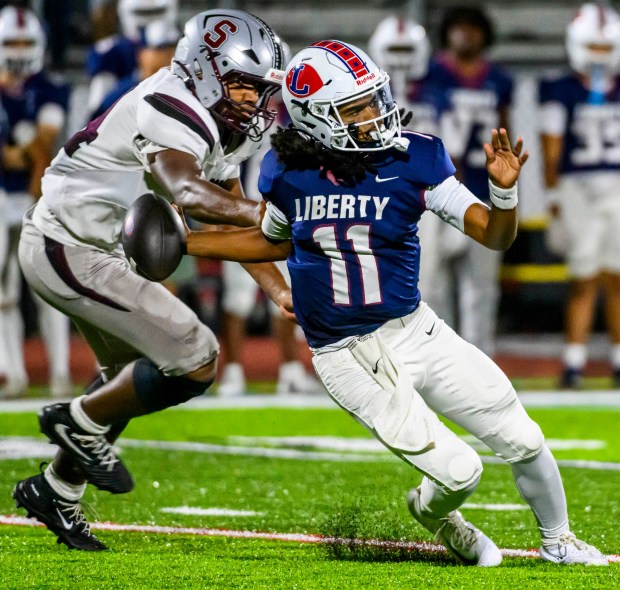 Liberty's quarterback Alsaiah Gross is stopped Thursday, Sept. 10, 2026, by Stroudsburg's Kevin Owusu-Ansah during a football game at BASD Stadium in Bethlehem.(April Gamiz/The Morning Call)