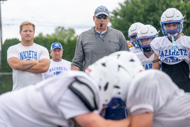 Nazareth coach Tom Falzone watches his players run drills Tuesday, August 18, 2026, during a practice session in Nazareth. (Jonathan Broady/Special to The Morning Call)