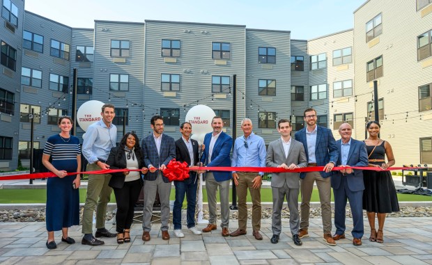 Allentown Mayor Matt Tuerk, City Center Group President and CEO J.B. Reilly and other dignitaries cut a ribbon Wednesday, Sept. 16, 2026, to mark the official opening of the Standard, City Center Group's 15th apartment building in downtown Allentown. The building, on the site of the former Morning Call office, has 257 apartments. (April Gamiz/The Morning Call)