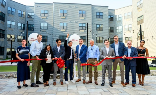 Allentown Mayor Matt Tuerk, City Center Group President and CEO J.B. Reilly and other dignitaries cut a ribbon Wednesday, Sept. 16, 2026, to mark the official opening of the Standard, City Center Group's 15th apartment building in downtown Allentown. The building, on the site of the former Morning Call office, has 257 apartments. (April Gamiz/The Morning Call)