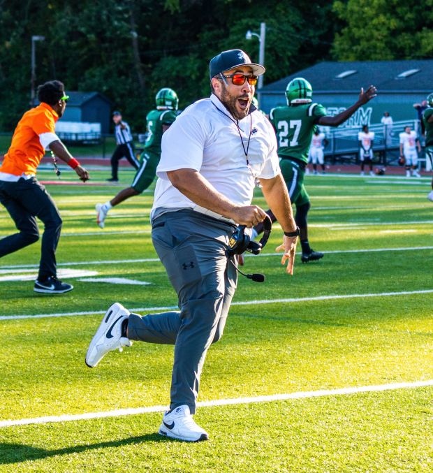 Lake Erie football coach David Price celebrates after his team beat Post on a Hail Mary touchdown pass Sept. 14, 2024. (News-Herald file)