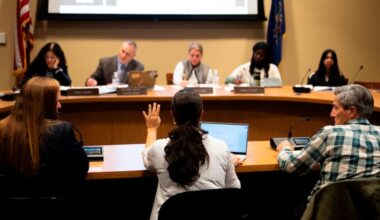 Members of the Lower Merion Board of School Directors speak with attendees at a school board meeting on Monday, May 11, 2026, in Ardmore, Pa. (AP Photo/Joe Lamberti)