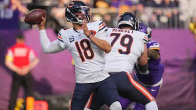 Nov 16, 2025; Minneapolis, Minnesota, USA; Chicago Bears quarterback Caleb Williams (18) throws downfield during the first quarter against the Minnesota Vikings at U.S. Bank Stadium.