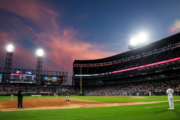 The sun sets during the third inning of the White Sox-Pirates game Sept. 10, 2026, at Rate Field. (Armando L. Sanchez/Chicago Tribune)