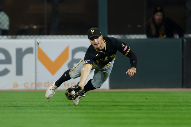 Pirates center fielder Jake Mangum (28) dives to catch a liner from White Sox first baseman Munetaka Murakami in the seventh inning Sept. 10, 2026, at Rate Field. (Armando L. Sanchez/Chicago Tribune)