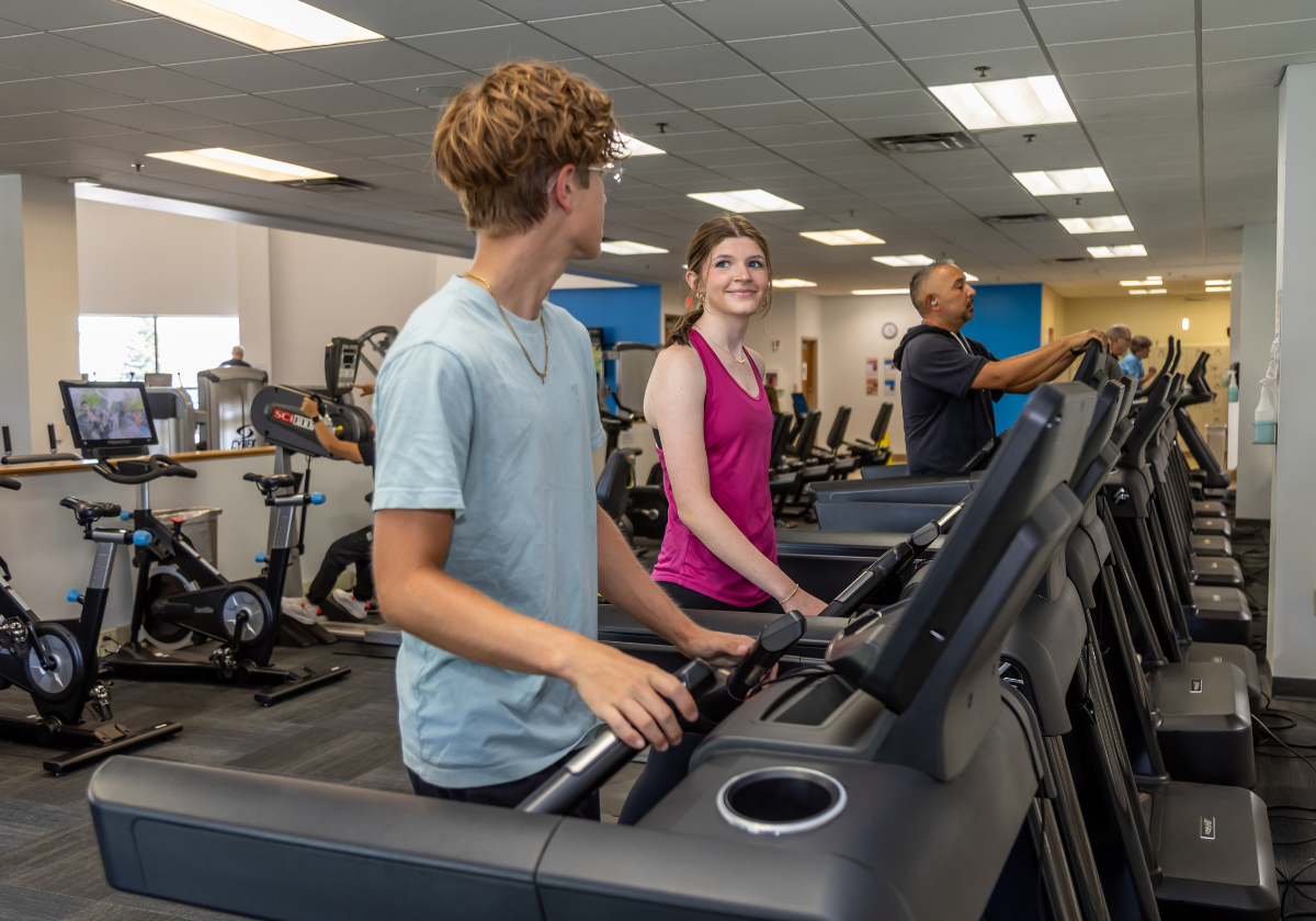 Teens exercise on treadmills in a YMCA of Greater Erie fitness center.