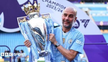 Manchester City manager Pep Guardiola lifting the 2023-24 Premier League title