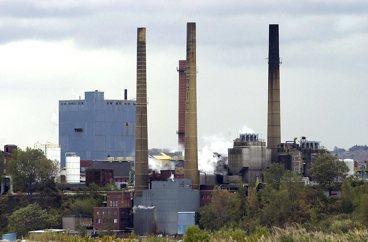 Hammermill smokestacks are crumbling. Two of them are coming down