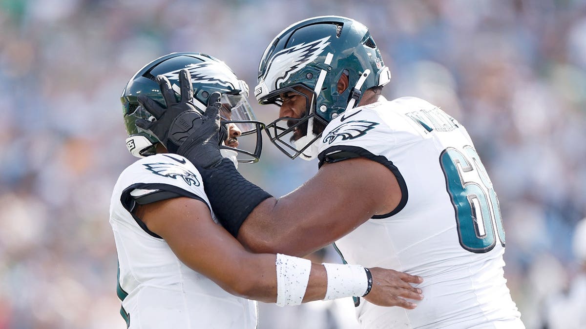 Jalen Hurts and Jordan Mailata celebrate after a touchdown.