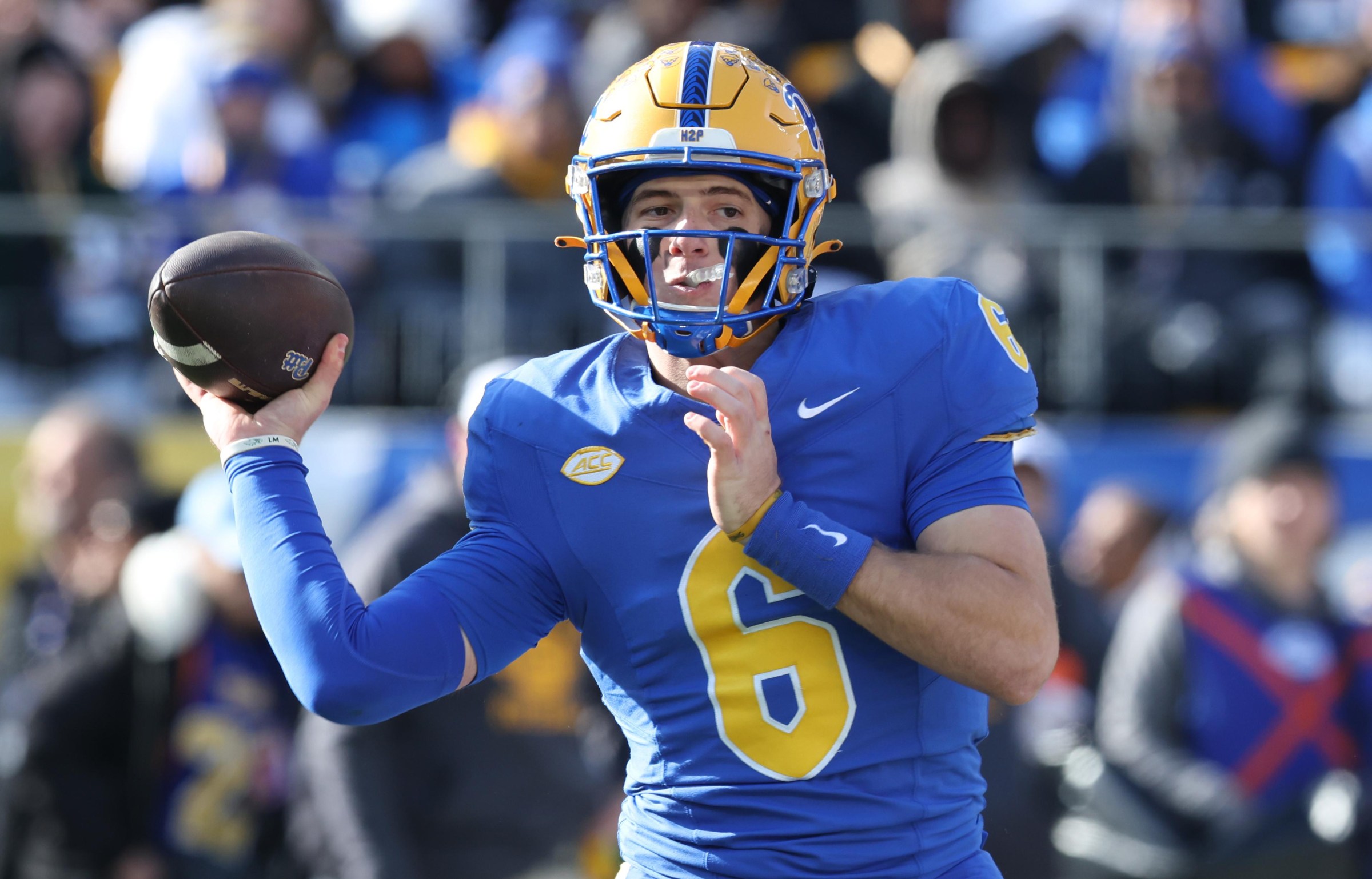 Nov 29, 2025; Pittsburgh, Pennsylvania, USA; Pittsburgh Panthers quarterback Mason Heintschel (6) passes against the Miami Hurricanes during the first quarter at Acrisure Stadium. Mandatory Credit: Charles LeClaire-Imagn Images