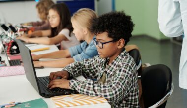 School students working on laptops.
