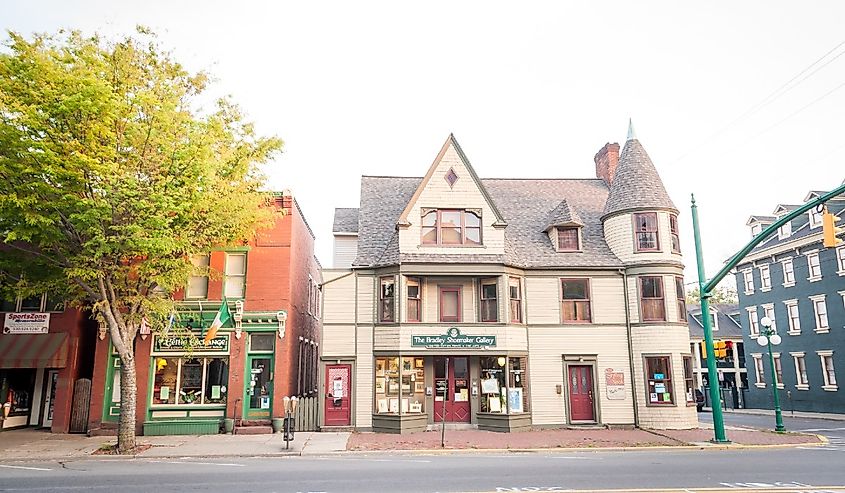 Brick storefronts and globe lampposts on Market Street in Lewisburg, Pennsylvania.