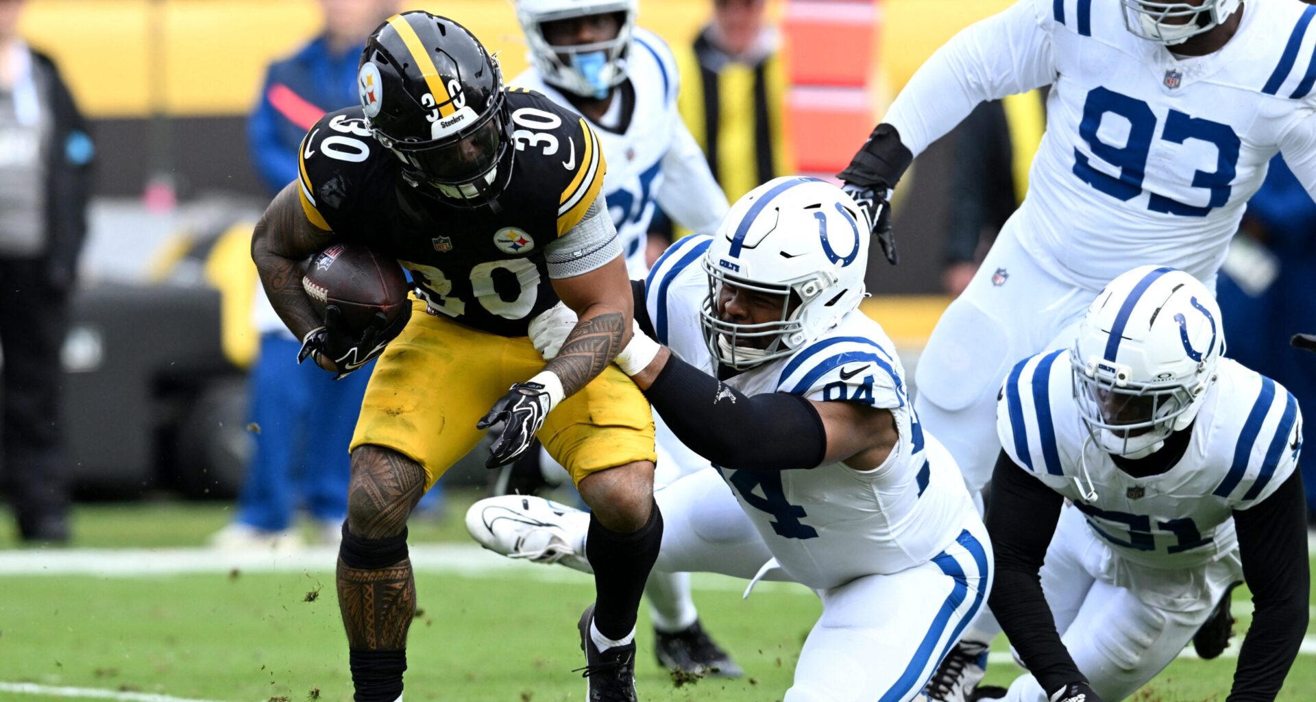 Oct 11, 2026; Pittsburgh, Pennsylvania, USA; Pittsburgh Steelers running back Jaylen Warren (30) is tackled by Indianapolis Colts defensive tackle Jerry Tillery (94) in the second quarter at Acrisure Stadium.