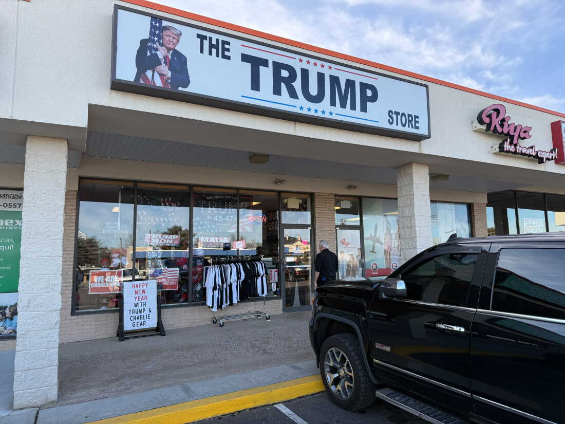 An image of President Trump hugging an American flag appears on a Trump store sign in suburban Philadelphia.