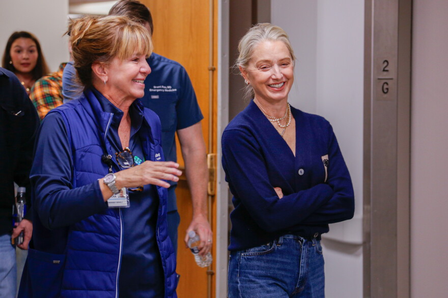 Director of Emergency Services at AGH, Kathy Sikora, left, and "The Pitt" star Katherine LaNasa, right, walk through the halls of Allegheny General Hospital on Oct. 26, 2026, in Pittsburgh.