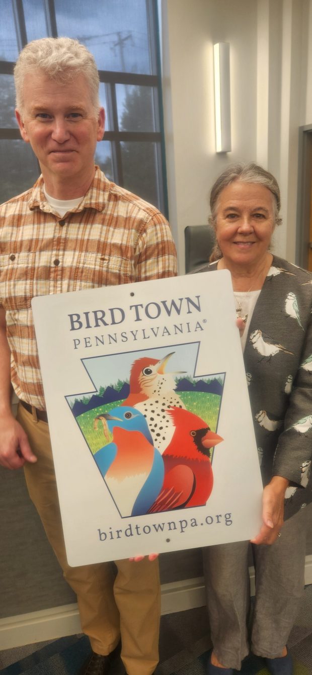 Borough Manager Sean Metrick and bird-lover Connie McEvoy show off the new Bird Town Pennsylvania sign. (BILL RETTEW/MEDIANEWS GROUP)