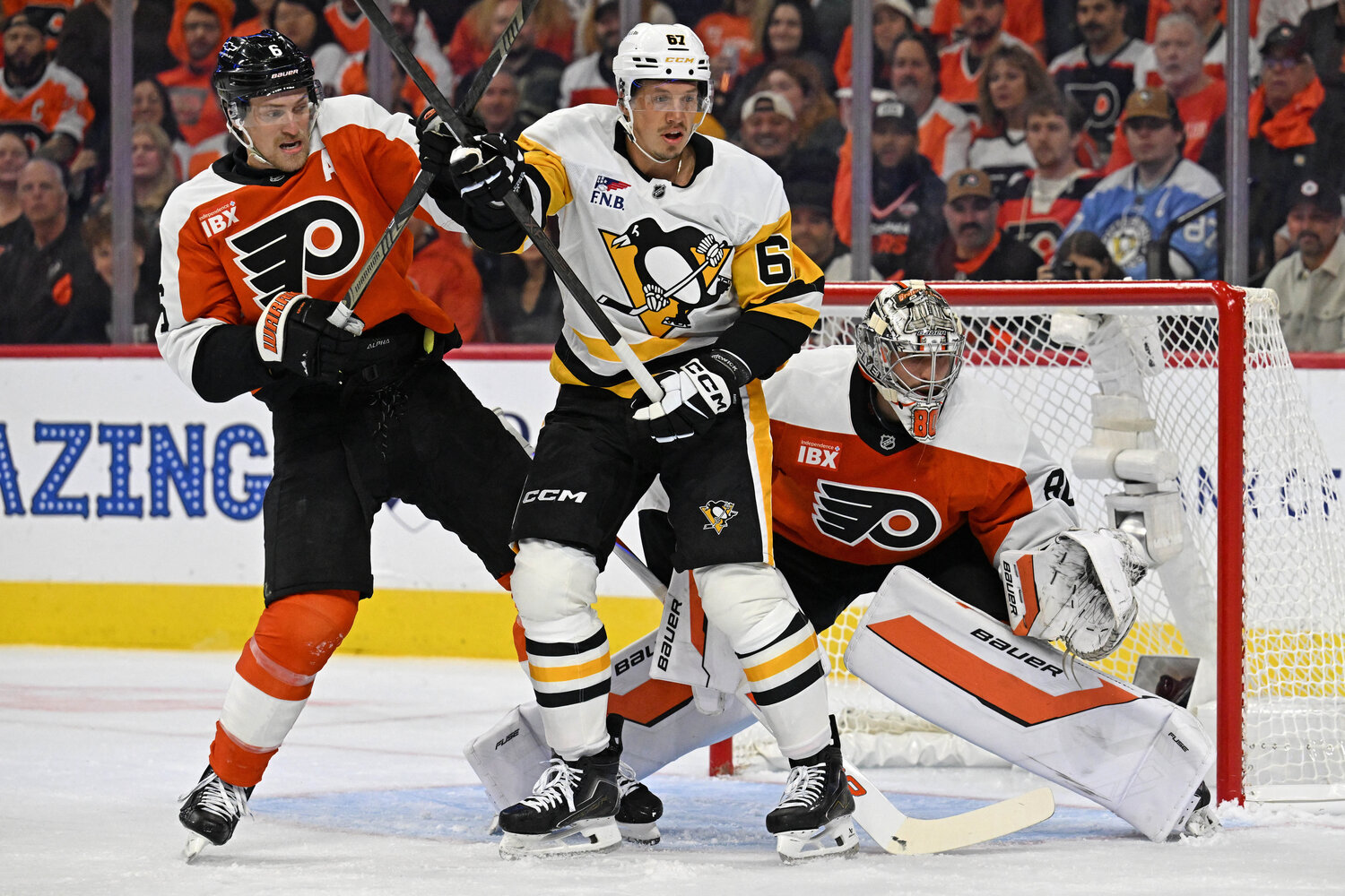 Sep 30, 2026; Philadelphia, Pennsylvania, USA; Philadelphia Flyers defenseman Travis Sanheim (6) and Pittsburgh Penguins right wing Rickard Rakell (67) battle for position in front of goaltender Dan Vladar (80) during the first period at Xfinity Mobile Arena.