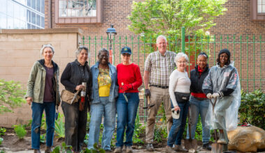 Volunteer planting are shown at The Anthenaeum with community garden leaders and landscape designer Wambui Ippolito.