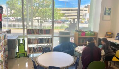 Five-year-old Elina draws and writes with a volunteer at St. Christopher&rsquo;s Hospital. &ldquo;I can tell you, when I go somewhere, she always takes me to the toys, not the books. But when she actually gets a book, that&rsquo;s very helpful,&rdquo; says her mother, Elizabeth.