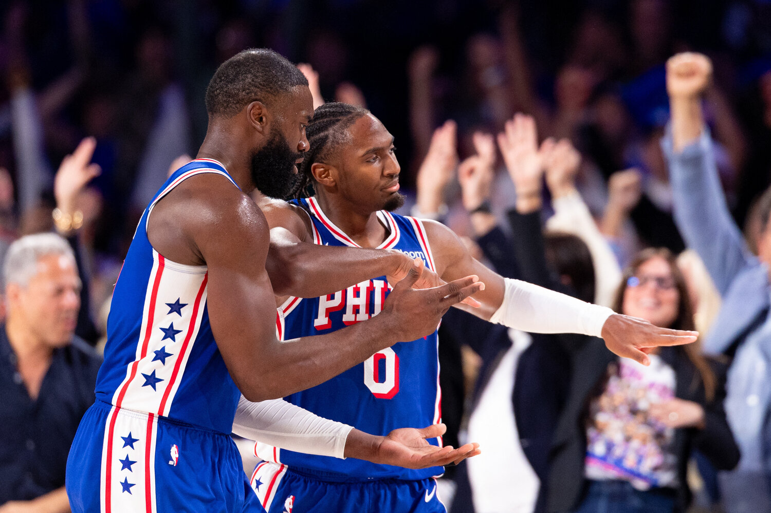 Philadelphia 76ers guard Tyrese Maxey (0) reacts alongside guard Jaylen Brown (7) after his three pointer against the Cleveland Cavaliers during the third quarter at Xfinity Mobile Arena.