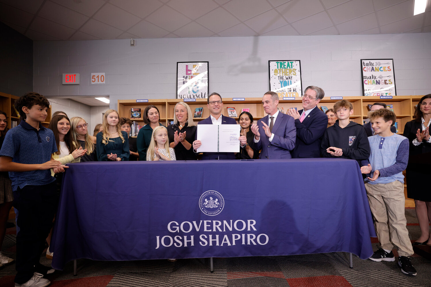 Gov. Josh Shapiro signs Senate Bill 1014 into law at Lenape Middle School in Doylestown, Bucks County on Monday, Oct. 26, 2026.