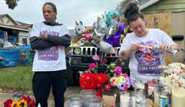 Julius Windham visits a memorial outside the home where authorities say a gunman killed multiple people, including Windham's daughter, in Erie, Pa., on Sunday, Oct. 11, 2026. (AP Photo/Ted Shaffrey)