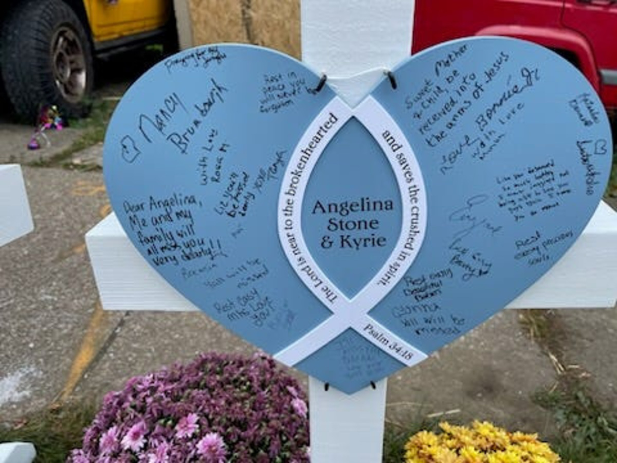 A memorial cross has been set up outside the site of 722 Perry St., where a mass shooting took place on Oct. 9. This cross honors Angelina Stone and her unborn baby Kyrie. In the face of such reckless violence, the author reminds us of the reverence and attention we owe one another.