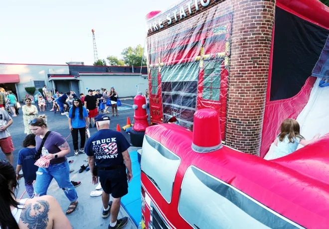 Children play in a fire-themed bouncy house during a National Night Out event at Belle Valley Fire Department in Millcreek Township, Pa., on Aug. 4, 2026. United Way of Erie County funded 20 events throughout the county.