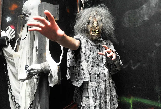 Jonathan Fischer, 14, of Erie, works at the Valley of the Ghouls haunted house behind the Belle Valley Fire Department in Millcreek Township on Oct. 15, 2011. JANET B. KUMMERER/