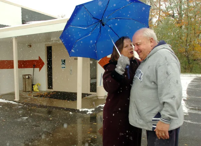 County Controller Sue Weber greets Millcreek township resident and friend Charles Dahlkemper outside the Belle Valley Fire Department where Dahlkemper went to vote on Tuesday, Nov. 6, 2007.