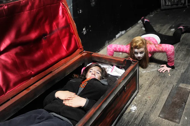 Cassie Bagnoni, 16, left, of Belle Valley, and Christine Kennelley, of Erie, work at the Valley of the Ghouls haunted house behind the Belle Valley Fire Department in Millcreek Township on Oct. 15, 2011. JANET B. KUMMERER/