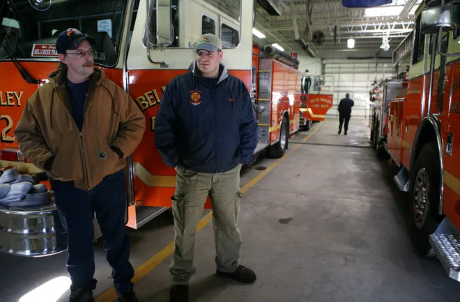 David Cassidy (l) and Alan Lonbardozzi, volunteer firefighters at the Belle Valley Fire Department, hang out after being called in to the station for a possible call to help at an accident scene on Feb. 3, 2007. The volunteers were not called out to the scene so they waited at the station for other possible calls.