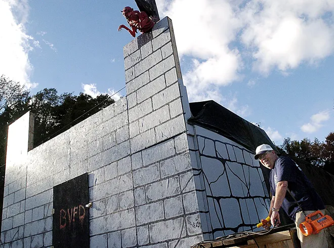 In this Oct. 3, 2004, file photo, Guy Lombardozzi is shown working on this haunted house at the Belle Valley Fire Department.