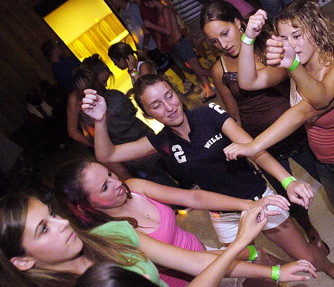(from bottom left) Rachael Hissom, 13, Brittany Friedman, 14, Madison Bott, 14, Kellie Schmitt, 14, and Brittany LaFuria, 14, dance at the Belle Valley Fire Hall on Sunday, July 10, 2005.