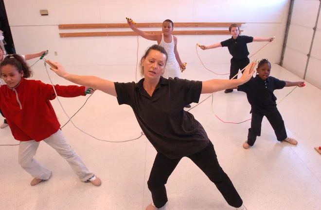 Larisa Melodinskaia, dance teacher at the Neighborhood Art House, teaches students a dance using jump ropes in November 2006. At left is Angelica Torres, 10. At right is Monifah Bailor, 8. Back center is Joseph Torres, 9, and back, right is Johnathan Miller, 10.
