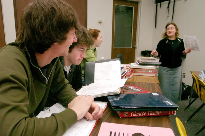 Fairview decathlon students, from left, Andrew Bolla, Jake Batchelor and Chrysten Maydak in homeroom with their teacher Laurie Hitt in February 2007.