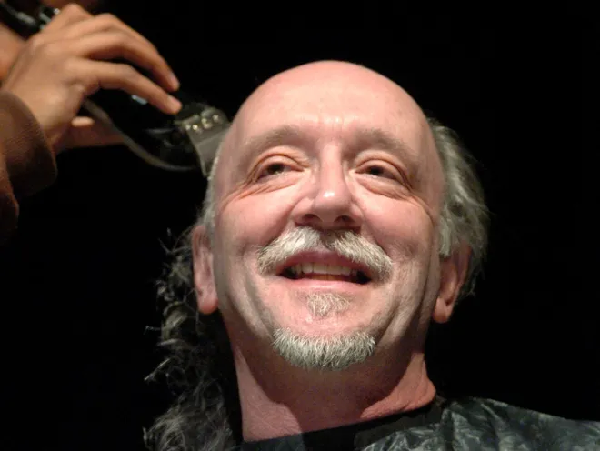 Iroquois High School's Justin Brown shaves the head of Iroquois art teacher Mark Bowen on May 8, 2007. Iroquois student Victoria Boriety had been battling leukemia and traveled with her family to Pittsburgh several times per week for treatments. The head-shaving was part of the "Bald is Beautiful" campaign that raised money for Boriety. The campaign surpassed its second goal which was to reach $10,000.