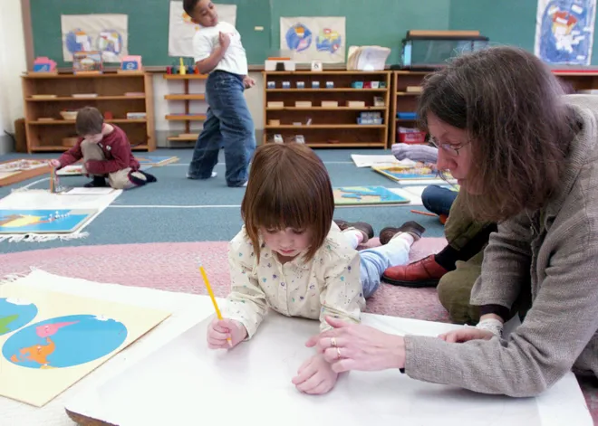 Glenridge Montessori Executive Director and teacher Pam Green works with Ava Imig, 4, on a map of the world during a preschool/kindergarten class on March 1, 2007.