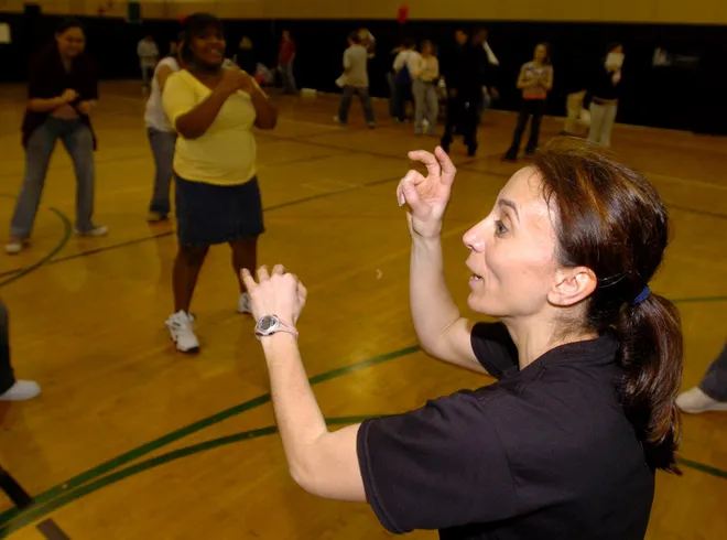 Sonja Groenendaal, health career academics teacher at Central, teaches students some kickboxing moves during the school's Smoke-Free Convention in April 2007.