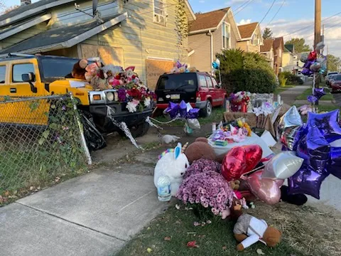 The memorial for the Erie mass shooting victims remains outside of 722 Perry St. on Oct. 13, 2026, nearly five days after the tragic shooting event took place.